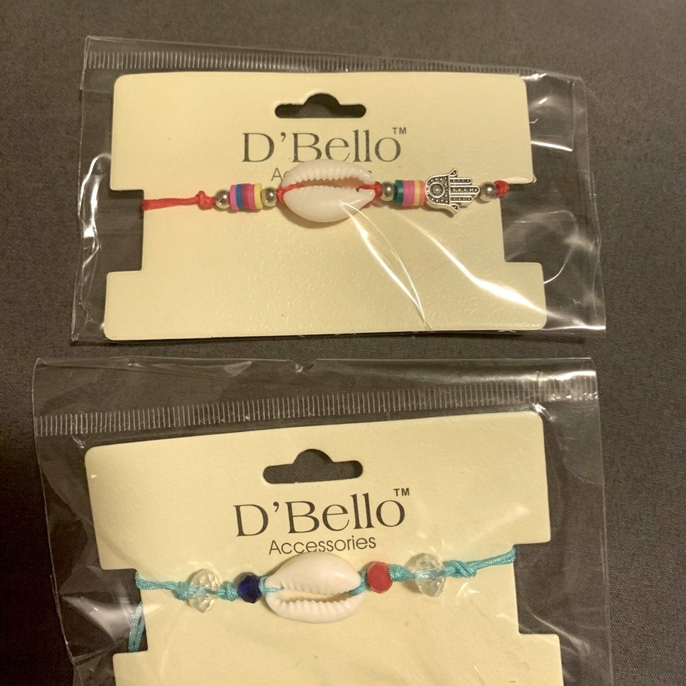 Two adjustable string bracelets with shell accent